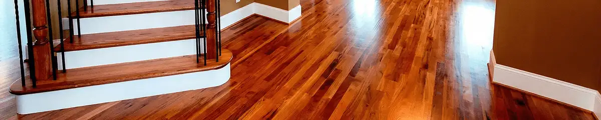 Base floor of a staircase with professionally restored wood flooring in Toledo OH