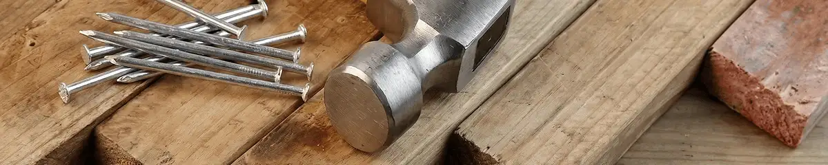 Hammer and nails on hardwood flooring boards in Toledo, OH