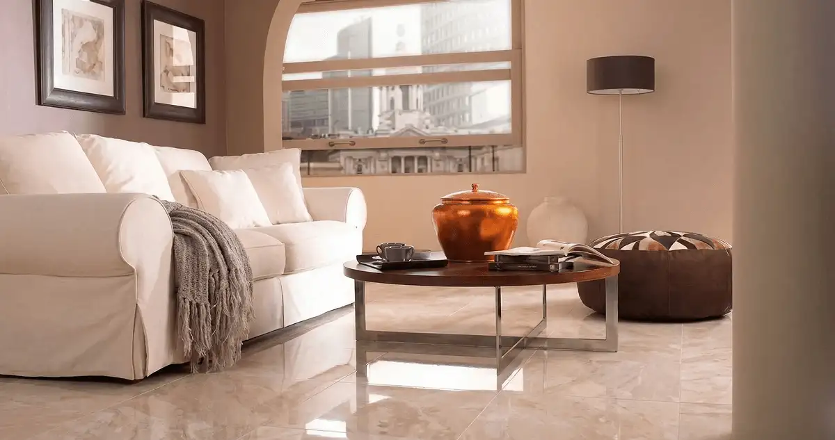 Modern living room with professionally installed marble flooring, a beige sofa, coffee table in Toledo, OH