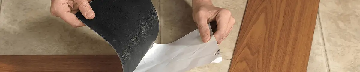 A professional installing vinyl flooring in Toledo, OH