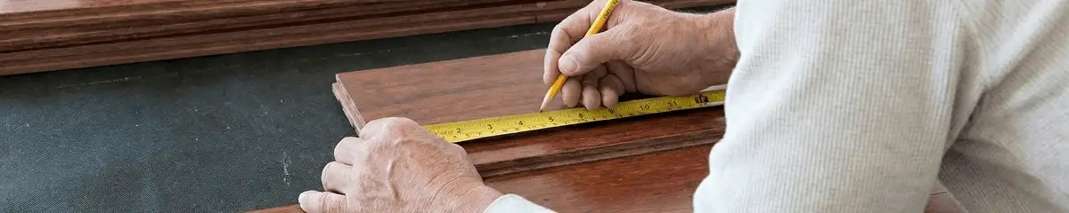 A professional installing wood flooring in Toledo, OH
