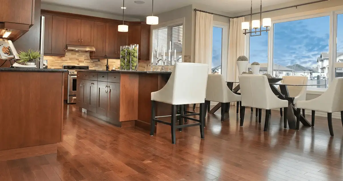 A modern kitchen with professionally installed wood flooring in Toledo, OH